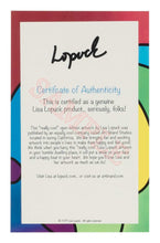 Load image into Gallery viewer, a book that is sitting on a table