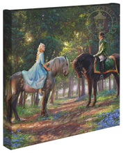 Load image into Gallery viewer, a group of people riding horses in the woods